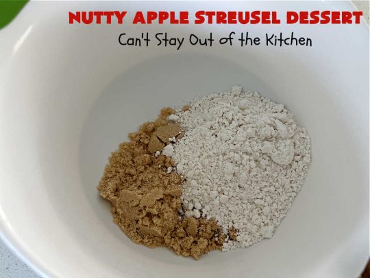 Nutty Apple Streusel Dessert | Can't Stay Out off the Kitchen | this is a fantastic old-world #vintage #dessert #recipe that's half #streusel & half #cobbler. The #apples spice things up & #Bisquick makes it easier to toss together. This #AppleDessert can also be made in the #SlowCooker. Top with #IceCream & everyone will be more than satisfied! #crockpot #almonds #AppleCobbler #NuttyAppleStreuselDessert