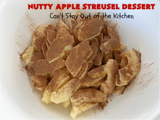 Nutty Apple Streusel Dessert | Can't Stay Out off the Kitchen | this is a fantastic old-world #vintage #dessert #recipe that's half #streusel & half #cobbler. The #apples spice things up & #Bisquick makes it easier to toss together. This #AppleDessert can also be made in the #SlowCooker. Top with #IceCream & everyone will be more than satisfied! #crockpot #almonds #AppleCobbler #NuttyAppleStreuselDessert