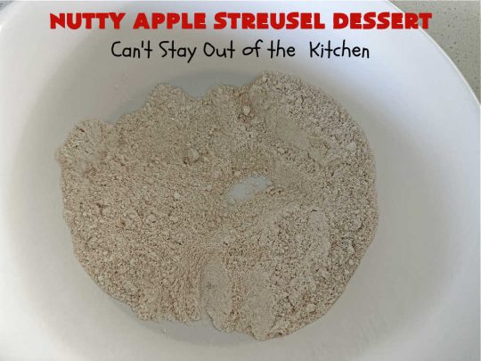 Nutty Apple Streusel Dessert | Can't Stay Out off the Kitchen | this is a fantastic old-world #vintage #dessert #recipe that's half #streusel & half #cobbler. The #apples spice things up & #Bisquick makes it easier to toss together. This #AppleDessert can also be made in the #SlowCooker. Top with #IceCream & everyone will be more than satisfied! #crockpot #almonds #AppleCobbler #NuttyAppleStreuselDessert