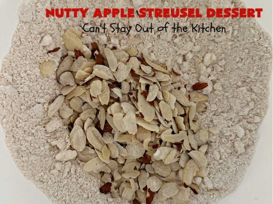 Nutty Apple Streusel Dessert | Can't Stay Out off the Kitchen | this is a fantastic old-world #vintage #dessert #recipe that's half #streusel & half #cobbler. The #apples spice things up & #Bisquick makes it easier to toss together. This #AppleDessert can also be made in the #SlowCooker. Top with #IceCream & everyone will be more than satisfied! #crockpot #almonds #AppleCobbler #NuttyAppleStreuselDessert