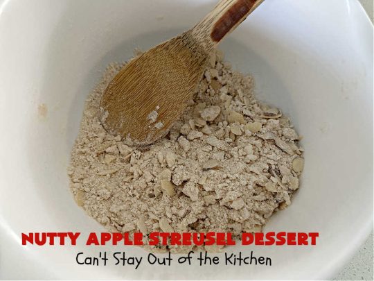 Nutty Apple Streusel Dessert | Can't Stay Out off the Kitchen | this is a fantastic old-world #vintage #dessert #recipe that's half #streusel & half #cobbler. The #apples spice things up & #Bisquick makes it easier to toss together. This #AppleDessert can also be made in the #SlowCooker. Top with #IceCream & everyone will be more than satisfied! #crockpot #almonds #AppleCobbler #NuttyAppleStreuselDessert