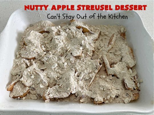 Nutty Apple Streusel Dessert | Can't Stay Out off the Kitchen | this is a fantastic old-world #vintage #dessert #recipe that's half #streusel & half #cobbler. The #apples spice things up & #Bisquick makes it easier to toss together. This #AppleDessert can also be made in the #SlowCooker. Top with #IceCream & everyone will be more than satisfied! #crockpot #almonds #AppleCobbler #NuttyAppleStreuselDessert