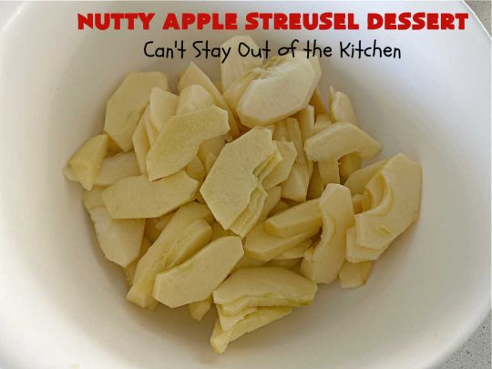 Nutty Apple Streusel Dessert | Can't Stay Out off the Kitchen | this is a fantastic old-world #vintage #dessert #recipe that's half #streusel & half #cobbler. The #apples spice things up & #Bisquick makes it easier to toss together. This #AppleDessert can also be made in the #SlowCooker. Top with #IceCream & everyone will be more than satisfied! #crockpot #almonds #AppleCobbler #NuttyAppleStreuselDessert