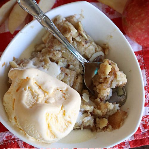 Nutty Apple Streusel Dessert | Can't Stay Out off the Kitchen | this is a fantastic old-world #vintage #dessert #recipe that's half #streusel & half #cobbler. The #apples spice things up & #Bisquick makes it easier to toss together. This #AppleDessert can also be made in the #SlowCooker. Top with #IceCream & everyone will be more than satisfied! #crockpot #almonds #AppleCobbler #NuttyAppleStreuselDessert