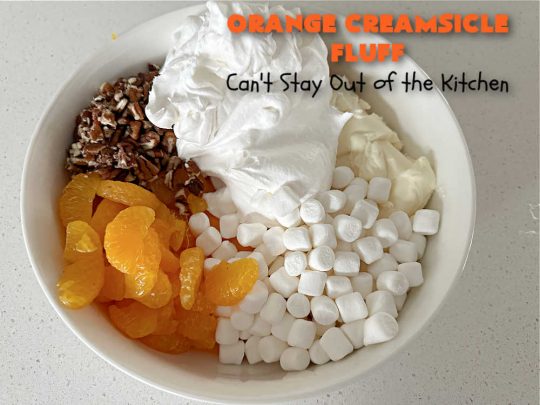 Orange Creamsicle Fluff | Can't Stay Out of the Kitchen | this fluffy #FruitSalad is outrageously good! It's smooth & creamy & tastes like eating #OrangeCreamsicle. #OrangeExtract makes it just pop in flavor. Terrific for company or #holiday dinners like #Easter, #MothersDay or #FathersDay. #pecans #marshmallows #MandarinOranges #MaraschinoCherries #OrangeCreamsicleFluff