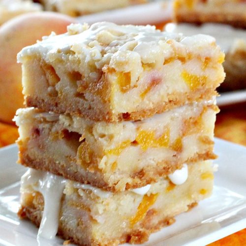 Peach Bars with Almond Drizzle | Can't Stay Out of the Kitchen | this heavenly #dessert uses fresh #peaches, has a streusel topping & glazed with #almond icing. Perfect #dessert for #LaborDay or other summer holidays.