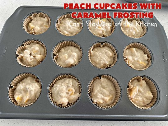 Peach Cupcakes with Caramel Frosting | Can't Stay Out of the Kitchen | these fabulous #cupcakes include fresh #peaches, #applesauce & #bananas in the batter. Then they're topped with a dreamy #CaramelFrosting. You'll be captivated and swooning over every bite. #dessert #PeachDessert #PeachCupcakes #PeachCupcakesWithCaramelFrosting