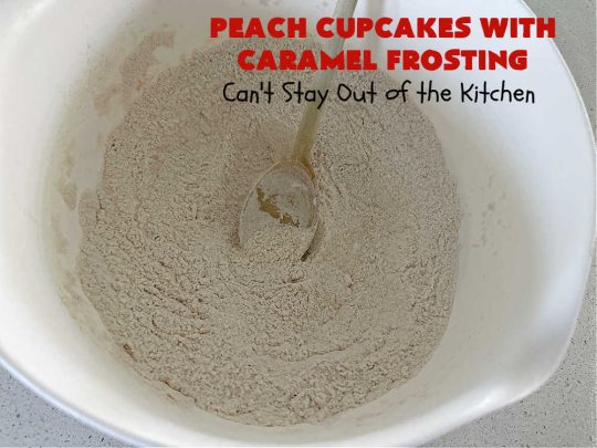 Peach Cupcakes with Caramel Frosting | Can't Stay Out of the Kitchen | these fabulous #cupcakes include fresh #peaches, #applesauce & #bananas in the batter. Then they're topped with a dreamy #CaramelFrosting. You'll be captivated and swooning over every bite. #dessert #PeachDessert #PeachCupcakes #PeachCupcakesWithCaramelFrosting