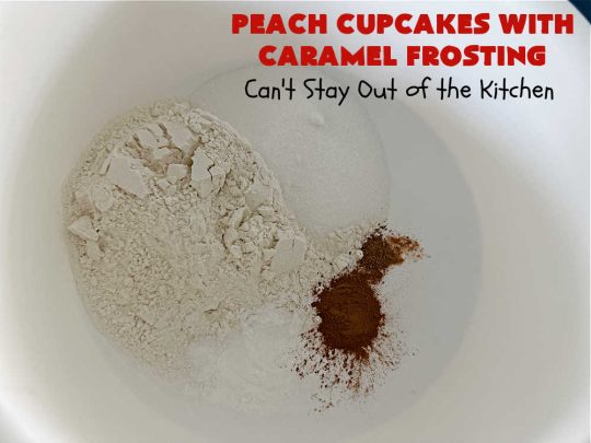 Peach Cupcakes with Caramel Frosting | Can't Stay Out of the Kitchen | these fabulous #cupcakes include fresh #peaches, #applesauce & #bananas in the batter. Then they're topped with a dreamy #CaramelFrosting. You'll be captivated and swooning over every bite. #dessert #PeachDessert #PeachCupcakes #PeachCupcakesWithCaramelFrosting