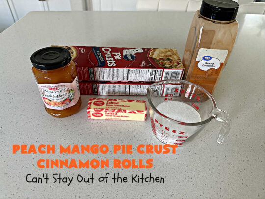 Peach Mango Pie Crust Cinnamon Rolls | Can't Stay Out of the Kitchen | These irresistible sweet treats contain a #PeachMango #fruit spread that's out of this world. This easy #5Ingredient #recipe can be whipped up in a jiffy. Terrific for #breakfast, #brunch or #tailgating snacks. If you enjoy #CinnamonRolls you'll love these little treasures. #cinnamon #PieCrust #PieCrustCinnamonRolls #PeachMangoPieCrustCinnamonRolls