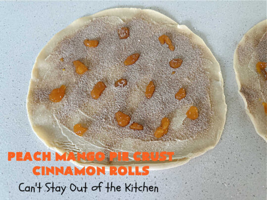 Peach Mango Pie Crust Cinnamon Rolls | Can't Stay Out of the Kitchen | These irresistible sweet treats contain a #PeachMango #fruit spread that's out of this world. This easy #5Ingredient #recipe can be whipped up in a jiffy. Terrific for #breakfast, #brunch or #tailgating snacks. If you enjoy #CinnamonRolls you'll love these little treasures. #cinnamon #PieCrust #PieCrustCinnamonRolls #PeachMangoPieCrustCinnamonRolls
