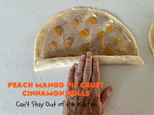 Peach Mango Pie Crust Cinnamon Rolls | Can't Stay Out of the Kitchen | These irresistible sweet treats contain a #PeachMango #fruit spread that's out of this world. This easy #5Ingredient #recipe can be whipped up in a jiffy. Terrific for #breakfast, #brunch or #tailgating snacks. If you enjoy #CinnamonRolls you'll love these little treasures. #cinnamon #PieCrust #PieCrustCinnamonRolls #PeachMangoPieCrustCinnamonRolls