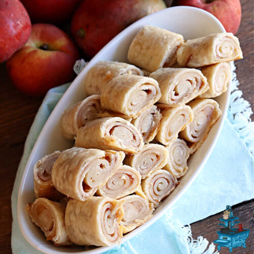 Peach Mango Pie Crust Cinnamon Rolls | Can't Stay Out of the Kitchen | These irresistible sweet treats contain a #PeachMango #fruit spread that's out of this world. This easy #5Ingredient #recipe can be whipped up in a jiffy. Terrific for #breakfast, #brunch or #tailgating snacks. If you enjoy #CinnamonRolls you'll love these little treasures. #cinnamon #PieCrust #PieCrustCinnamonRolls #PeachMangoPieCrustCinnamonRolls