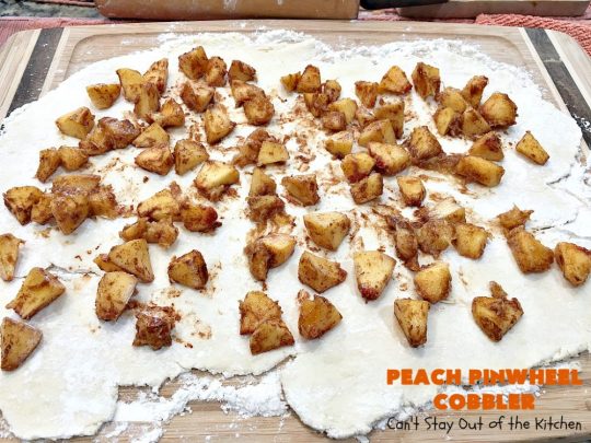Peach Pinwheel Cobbler | Can't Stay Out of the Kitchen | this is one fantastic #PeachCobbler! #Peaches are wrapped up in dough pinwheel fashion. Syrup is poured over top before baking. The pinwheels absorb the syrup & puff up really large. This is absolutely heavenly. Wonderful #summer #dessert. #PeachDessert #cobbler #PeachPinwheelCobbler #Canbassador #WashingtonStateFruitCommission #WashingtonStoneFruitGrowers #WashingtonStateStoneFruitGrowers