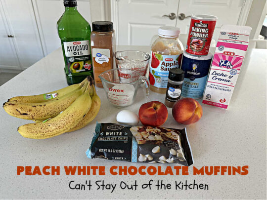 Peach White Chocolate Muffins | Can't Stay Out of the Kitchen | these delectable #muffins are "knock-your-socks-off" good! Every bite is filled with fresh #peaches, #WhiteChocolateChips, #bananas, #applesauce, #cinnamon & #nutmeg. #Chocolate & #FreshPeaches go so well together. Excellent option for #breakfast or #brunch #menus. #holiday #HolidayBreakfast #PeachWhiteChocolateMuffins