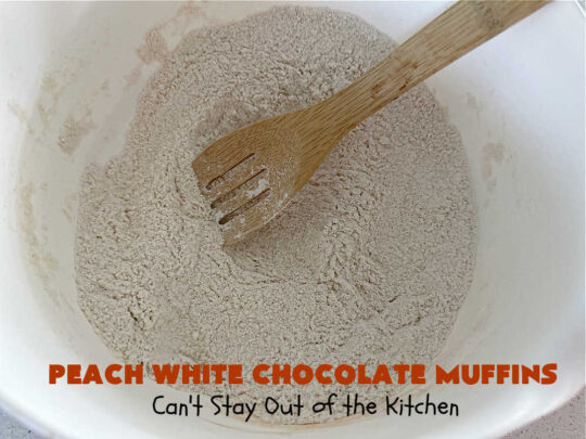 Peach White Chocolate Muffins | Can't Stay Out of the Kitchen | these delectable #muffins are "knock-your-socks-off" good! Every bite is filled with fresh #peaches, #WhiteChocolateChips, #bananas, #applesauce, #cinnamon & #nutmeg. #Chocolate & #FreshPeaches go so well together. Excellent option for #breakfast or #brunch #menus. #holiday #HolidayBreakfast #PeachWhiteChocolateMuffins