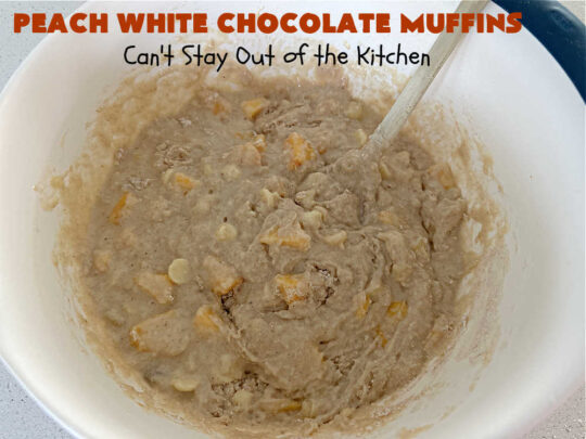 Peach White Chocolate Muffins | Can't Stay Out of the Kitchen | these delectable #muffins are "knock-your-socks-off" good! Every bite is filled with fresh #peaches, #WhiteChocolateChips, #bananas, #applesauce, #cinnamon & #nutmeg. #Chocolate & #FreshPeaches go so well together. Excellent option for #breakfast or #brunch #menus. #holiday #HolidayBreakfast #PeachWhiteChocolateMuffins