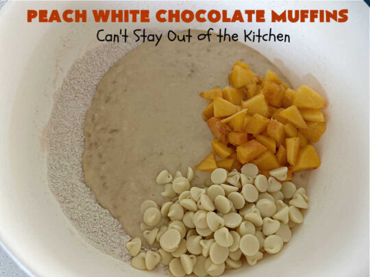 Peach White Chocolate Muffins | Can't Stay Out of the Kitchen | these delectable #muffins are "knock-your-socks-off" good! Every bite is filled with fresh #peaches, #WhiteChocolateChips, #bananas, #applesauce, #cinnamon & #nutmeg. #Chocolate & #FreshPeaches go so well together. Excellent option for #breakfast or #brunch #menus. #holiday #HolidayBreakfast #PeachWhiteChocolateMuffins