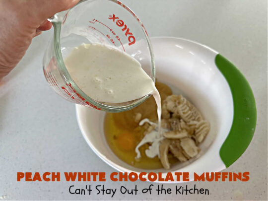 Peach White Chocolate Muffins | Can't Stay Out of the Kitchen | these delectable #muffins are "knock-your-socks-off" good! Every bite is filled with fresh #peaches, #WhiteChocolateChips, #bananas, #applesauce, #cinnamon & #nutmeg. #Chocolate & #FreshPeaches go so well together. Excellent option for #breakfast or #brunch #menus. #holiday #HolidayBreakfast #PeachWhiteChocolateMuffins