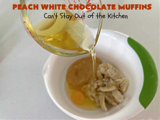 Peach White Chocolate Muffins | Can't Stay Out of the Kitchen | these delectable #muffins are "knock-your-socks-off" good! Every bite is filled with fresh #peaches, #WhiteChocolateChips, #bananas, #applesauce, #cinnamon & #nutmeg. #Chocolate & #FreshPeaches go so well together. Excellent option for #breakfast or #brunch #menus. #holiday #HolidayBreakfast #PeachWhiteChocolateMuffins