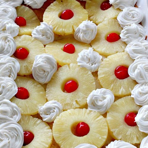 Pina Colada Earthquake Cake | Can't Stay Out of the Kitchen | best #cake ever! This heavenly #dessert is filled with #pineapple, #coconut, macadamia nuts & vanilla chips. #Creamcheese frosting bakes into the cake causing it to crater, erupt & explode in an earthquake! Perfect for #holidays or special occasions.