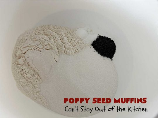 Poppy Seed Muffins | Can't Stay Out of the Kitchen | these delightful #muffins explode with flavor by using #AlmondExtract, #VanillaExtract, #ButterFlavoring & #PoppySeeds. Every bite will cure your sweet tooth cravings! Great for a weekend, company or #holiday #breakfast, #tailgating parties, backyard barbecues, or family picnics. These muffins travel & freeze well. #PoppySeedMuffins