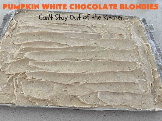 Pumpkin White Chocolate Blondies | Can't Stay Out of the Kitchen | these luscious #brownies include a #pumpkin base with #WhiteChocolateChips, #cinnamon, #nutmeg, #cloves, #ginger & #allspice. They're topped with a rich, decadent #icing on top. Perfect for #FallBaking, #tailgating, #Potlucks, #BackyardBarbecues or a #ChristmasCookieExchange. #cookies #chocolate #PumpkinWhiteChocolateBlondies