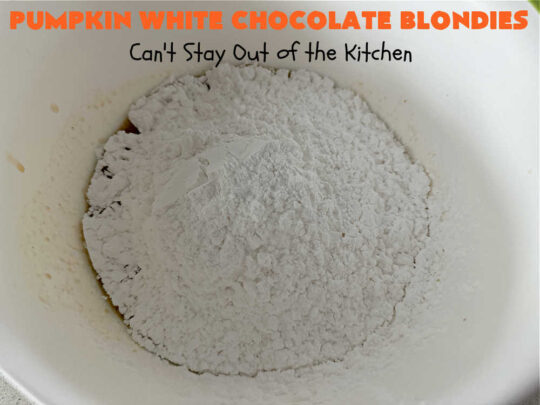 Pumpkin White Chocolate Blondies | Can't Stay Out of the Kitchen | these luscious #brownies include a #pumpkin base with #WhiteChocolateChips, #cinnamon, #nutmeg, #cloves, #ginger & #allspice. They're topped with a rich, decadent #icing on top. Perfect for #FallBaking, #tailgating, #Potlucks, #BackyardBarbecues or a #ChristmasCookieExchange. #cookies #chocolate #PumpkinWhiteChocolateBlondies