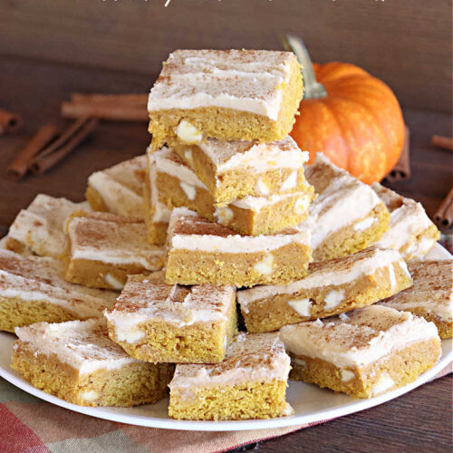 Pumpkin White Chocolate Blondies | Can't Stay Out of the Kitchen | these luscious #brownies include a #pumpkin base with #WhiteChocolateChips, #cinnamon, #nutmeg, #cloves, #ginger & #allspice. They're topped with a rich, decadent #icing on top. Perfect for #FallBaking, #tailgating, #Potlucks, #BackyardBarbecues or a #ChristmasCookieExchange. #cookies #chocolate #PumpkinWhiteChocolateBlondies