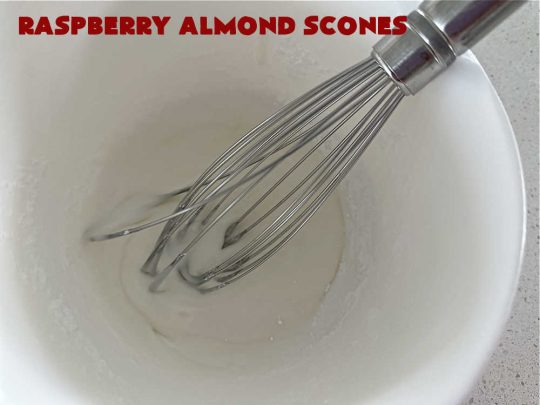 Raspberry Almond Scones | Can't Stay Out of the Kitchen | these delicious #scones are a perfect idea for a company or #holiday #breakfast, like #Thanksgiving or #Christmas. They're filled with fresh #raspberries, sliced #almonds & include #AlmondExtract in the batter as well as the icing. Every bite will rock your world! If you enjoy a sweet treat with your morning coffee, you'll love these! #RaspberryAlmondScones