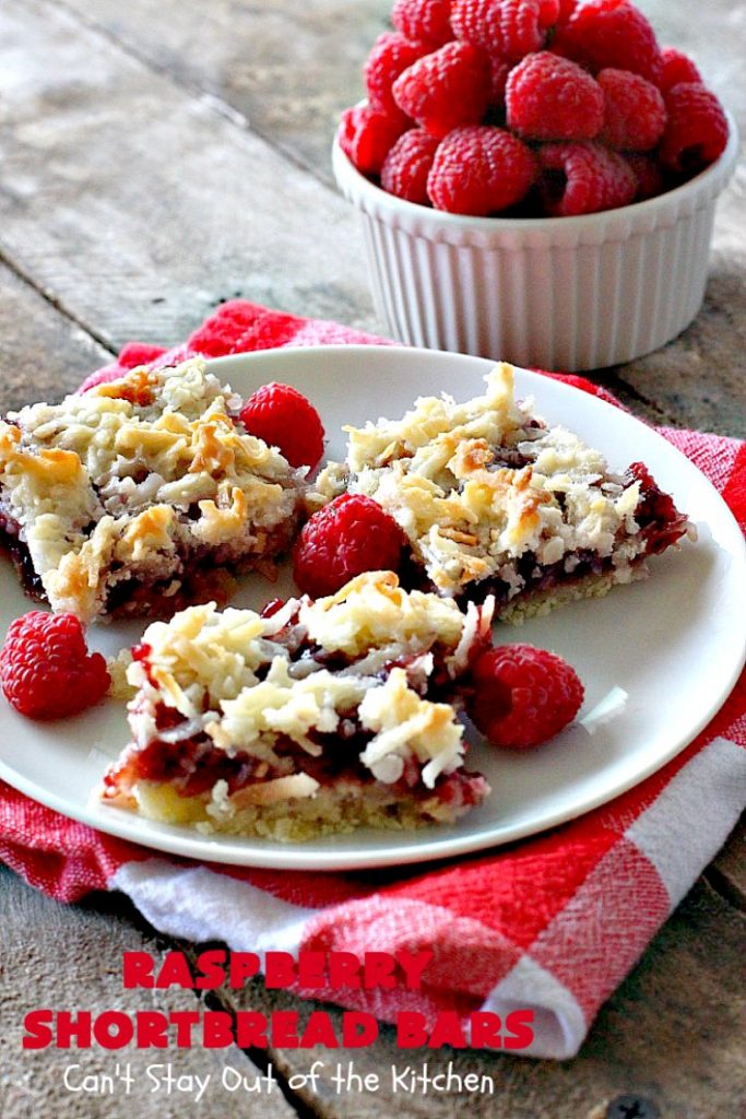 Raspberry Shortbread Bars | Can't Stay Out of the Kitchen | these #cookie type bars are absolutely divine! They have a shortbread crust, topped with #raspberry preserves & a #coconut topping. You'll be drooling over every bite! #dessert