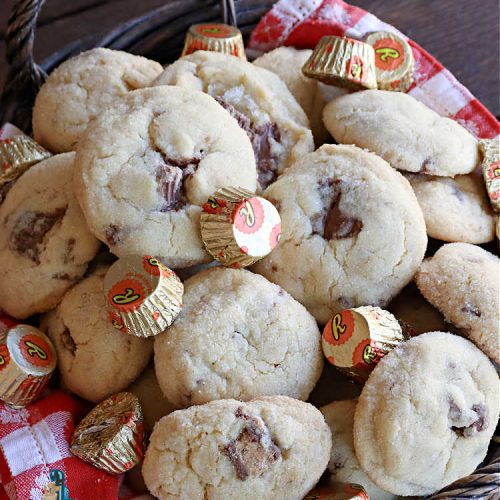 Reese's Peanut Butter Cup Meltaways | Can't Stay Out of the Kitchen | these glorious #cookies simply dissolve in your mouth! They're fantastic #SugarCookies with #ReesesPeanutButterCups added. They're so swoon-worthy you'll be drooling over every bite. Great for #tailgating parties, potlucks & #holiday #baking. #chocolate #PeanutButter #ReesesPeanutButterCupMeltaways