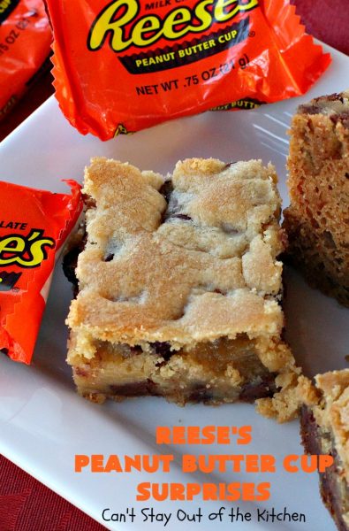 Reese's Peanut Butter Cup Surprises | Can't Stay Out of the Kitchen | these awesome #brownies have #ReesesPeanutButterCups tucked away between two layers of #MrsFieldsChocolateChipCookie dough. They are rich, decadent & absolutely heavenly. Perfect for #tailgating parties, a company #dessert or a #ChristmasCookieExchange. #PeanutButter #PeanutButterCups #chocolate #ReesesPeanutButterCupSurprises