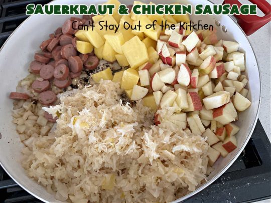 Sauerkraut and Chicken Sausage | Can't Stay Out of the Kitchen | every bite of this easy & delicious #MainDish #recipe is succulent & amazing. It's made with #sauerkraut, #apples, #ChickenSausage, #bacon, #potatoes, #CarawaySeeds & #AppleJuice. The combination of flavors is mouthwatering & irresistible. Takes only 40 minutes to whip up so it can be made in a snap for weeknight dinners. #pork #chicken #kielbasa #SmokedSausage #GlutenFree #SauerkrautAndChickenSausage