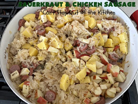 Sauerkraut and Chicken Sausage | Can't Stay Out of the Kitchen | every bite of this easy & delicious #MainDish #recipe is succulent & amazing. It's made with #sauerkraut, #apples, #ChickenSausage, #bacon, #potatoes, #CarawaySeeds & #AppleJuice. The combination of flavors is mouthwatering & irresistible. Takes only 40 minutes to whip up so it can be made in a snap for weeknight dinners. #pork #chicken #kielbasa #SmokedSausage #GlutenFree #SauerkrautAndChickenSausage