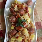 Sauerkraut and Sausage | Can't Stay Out of the Kitchen | this easy #MainDish #recipe is a great option for busy weeknight dinners. You'll enjoy the savory #pork flavors which include both #bacon & #kielbasa. Apples, #potatoes, #sauerkraut & #CarawaySeeds finish off this fantastic #SauerkrautAndSausage #entree. The savory & sweet flavors contrast so wonderfully that every bite is irresistible. #GlutenFree