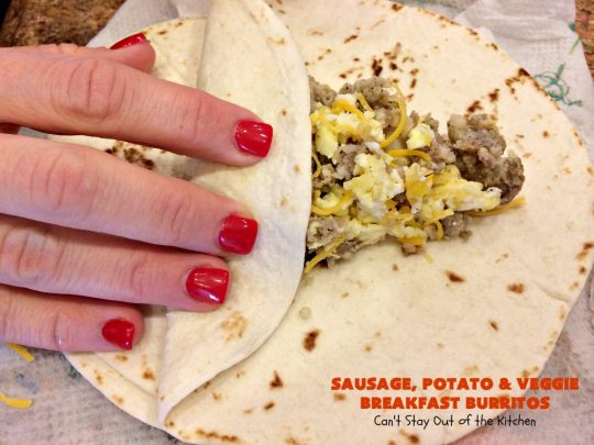 Sausage, Potato and Veggie Breakfast Burritos | Can't Stay Out of the Kitchen | these #BreakfastBurritos are fantastic. Every mouthful will have you drooling. Plus, they can be made up in advance & then popped in the microwave before heading out to work! #sausage #pork #eggs #cheese #potatoes #mushrooms #tortillas #TexMex #breakfast #HolidayBreakfast #SausagePotatoAndVeggieBreakfastBurritos
