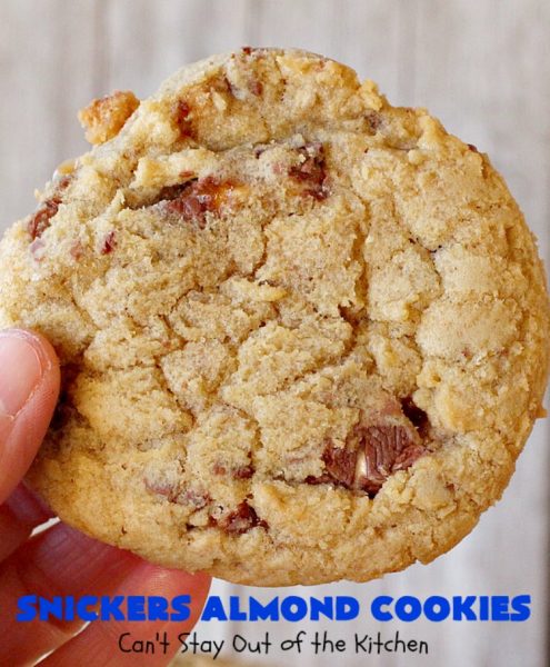 Snickers Almond Cookies | Can't Stay Out of the Kitchen | these scrumptious #cookies will cure any sweet tooth craving. This #dessert uses #SnickersAlmondBars in the dough. So they're filled with #chocolate & #almonds. Every bite will have you salivating. #tailgating #holiday #baking #HolidayBaking #HolidayDessert #SnickersDessert #ChocolateDessert #AlmondDessert #ChristmasCookieExchange #Snickers #SnickersBars #SnickersAlmondCookies