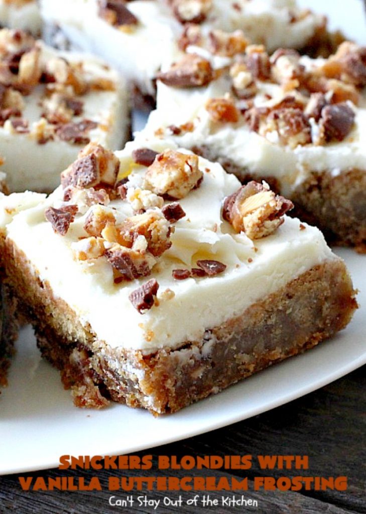 Snickers Blondies with Vanilla Buttercream Frosting | Can't Stay Out of the Kitchen | these outrageous #brownies are divine! The frosting is oh, so heavenly. One bite and you'll be drooling! #dessert #snickers #chocolate