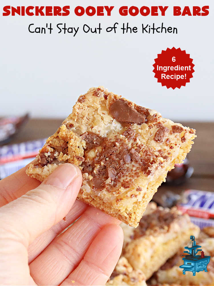 Snickers Ooey Gooey Bars | Can't Stay Out of the Kitchen | these luscious #OoeyGooeyBars contain a #cheesecake layer & they're topped with #SnickersBars for a lovely #chocolate & #PeanutButter flavor that will win over all your family & friends. This 6-ingredient #recipe is perfect for #tailgating parties, potlucks or a #ChristmasCookieExchange. It's easy to whip up & everyone loves them! #holiday #HolidayDessert #SnickersDessert #dessert #brownie #SnickersOoeyGooeyBars