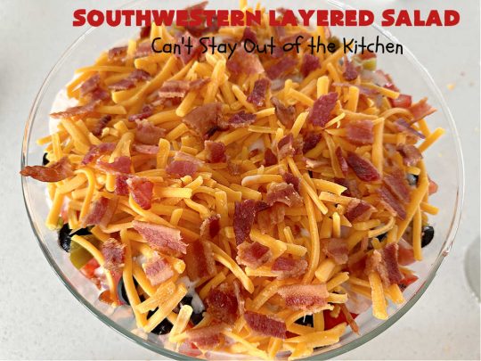 Southwestern Layered Salad | Can't Stay Out of the Kitchen | this scrumptious #LayeredSalad is perfect for company or a crowd since it makes a lot! If you enjoy #TexMex flavor in your #salad or a #TacoSalad this #salad will be right up your alley. The #Southwestern flavors are marvelous & the heartiness of two types of #beans & #corn make this a #MainDishSalad that can't be beat! #bacon #tomatoes #CheddarCheese #Fritos #olives #RanchDressing #FritosCornChips #avocados #pork #SouthwesternLayeredSalad #GlutenFree