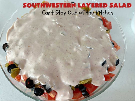 Southwestern Layered Salad | Can't Stay Out of the Kitchen | this scrumptious #LayeredSalad is perfect for company or a crowd since it makes a lot! If you enjoy #TexMex flavor in your #salad or a #TacoSalad this #salad will be right up your alley. The #Southwestern flavors are marvelous & the heartiness of two types of #beans & #corn make this a #MainDishSalad that can't be beat! #bacon #tomatoes #CheddarCheese #Fritos #olives #RanchDressing #FritosCornChips #avocados #pork #SouthwesternLayeredSalad #GlutenFree