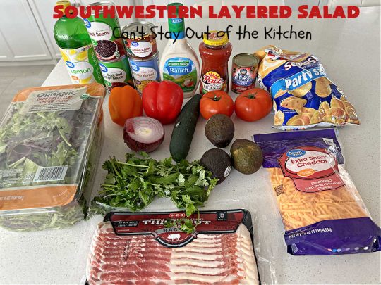 Southwestern Layered Salad | Can't Stay Out of the Kitchen | this scrumptious #LayeredSalad is perfect for company or a crowd since it makes a lot! If you enjoy #TexMex flavor in your #salad or a #TacoSalad this #salad will be right up your alley. The #Southwestern flavors are marvelous & the heartiness of two types of #beans & #corn make this a #MainDishSalad that can't be beat! #bacon #tomatoes #CheddarCheese #Fritos #olives #RanchDressing #FritosCornChips #avocados #pork #SouthwesternLayeredSalad #GlutenFree