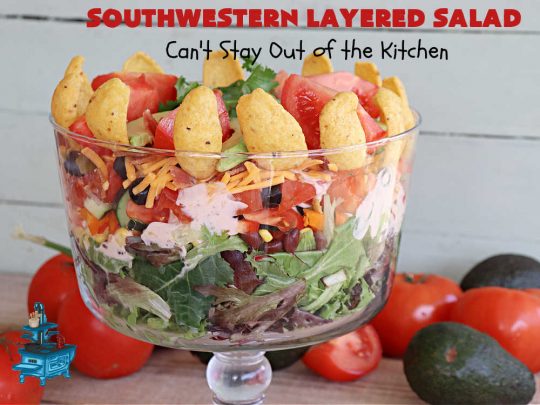 Southwestern Layered Salad | Can't Stay Out of the Kitchen | this scrumptious #LayeredSalad is perfect for company or a crowd since it makes a lot! If you enjoy #TexMex flavor in your #salad or a #TacoSalad this #salad will be right up your alley. The #Southwestern flavors are marvelous & the heartiness of two types of #beans & #corn make this a #MainDishSalad that can't be beat! #bacon #tomatoes #CheddarCheese #Fritos #olives #RanchDressing #FritosCornChips #avocados #pork #SouthwesternLayeredSalad #GlutenFree