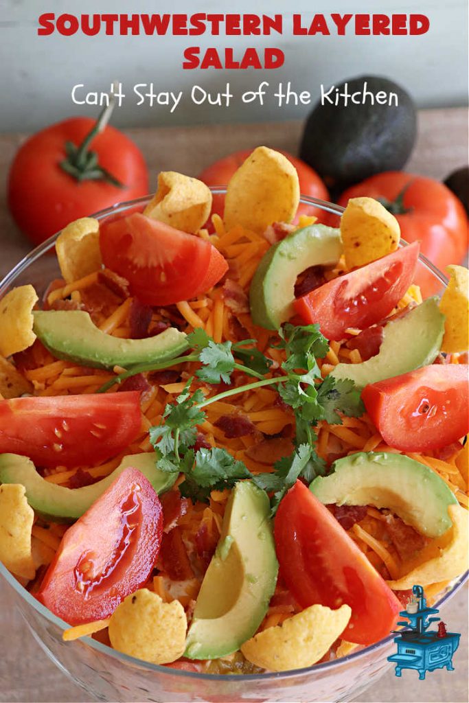 Southwestern Layered Salad | Can't Stay Out of the Kitchen | this scrumptious #LayeredSalad is perfect for company or a crowd since it makes a lot! If you enjoy #TexMex flavor in your #salad or a #TacoSalad this #salad will be right up your alley. The #Southwestern flavors are marvelous & the heartiness of two types of #beans & #corn make this a #MainDishSalad that can't be beat! #bacon #tomatoes #CheddarCheese #Fritos #olives #RanchDressing #FritosCornChips #avocados #pork #SouthwesternLayeredSalad #GlutenFree