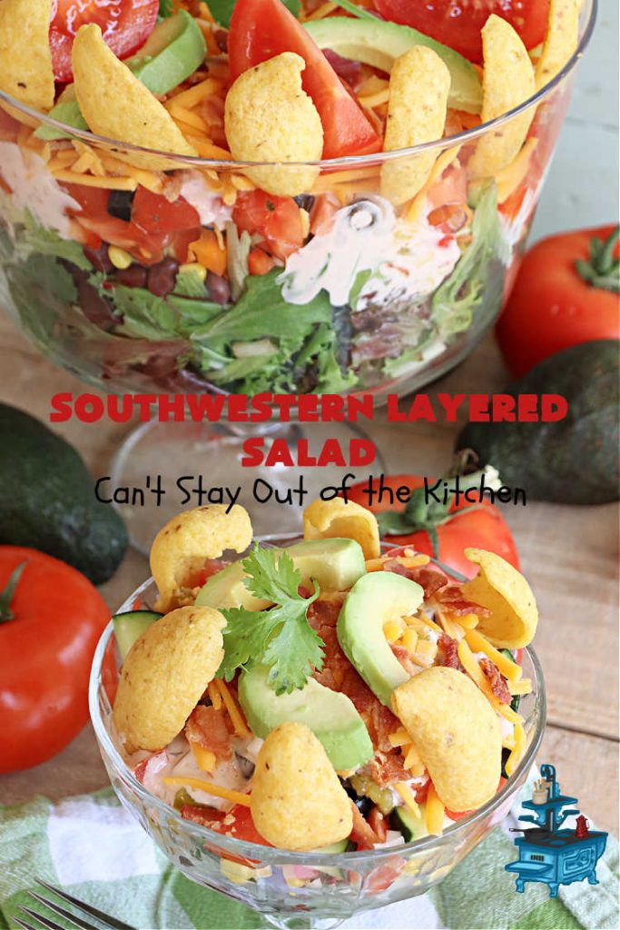 Southwestern Layered Salad | Can't Stay Out of the Kitchen | this scrumptious #LayeredSalad is perfect for company or a crowd since it makes a lot! If you enjoy #TexMex flavor in your #salad or a #TacoSalad this #salad will be right up your alley. The #Southwestern flavors are marvelous & the heartiness of two types of #beans & #corn make this a #MainDishSalad that can't be beat! #bacon #tomatoes #CheddarCheese #Fritos #olives #RanchDressing #FritosCornChips #avocados #pork #SouthwesternLayeredSalad #GlutenFree