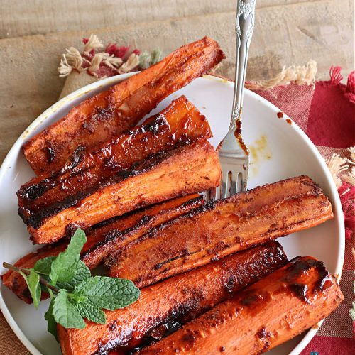 Spicy Honey-Brushed Carrots | Can't Stay Out of the Kitchen | this delicious way to serve #carrots is absolutely mouthwatering & irresistible. The #vegetable is seasoned well with spices and baked. Then a #honey and #AppleCiderVinegar mixture is brushed on top and baked again. Amazing #SideDish for weeknight, company or #holiday dinners. #GlutenFree #vegan #healthy #SpicyHoneyBrushedCarrots