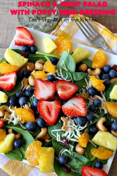 Spinach and Fruit Salad with Poppy Seed Dressing | this is one of our favorite #salad #recipes. It's filled with #strawberries, #Blueberries, #pineapple & #MandarinOranges. It also has #Cashews & #SwissCheese. No one can resist this amazing #TossedSalad! We serve it for company all the time. #holiday #HolidaySalad #TossedSaladWithFruit #SpinachSalad #SpinachAndFruitSaladWithPoppySeedDressing #PoppySeedDressing #GlutenFree #Healthy #HealthySaladRecipe