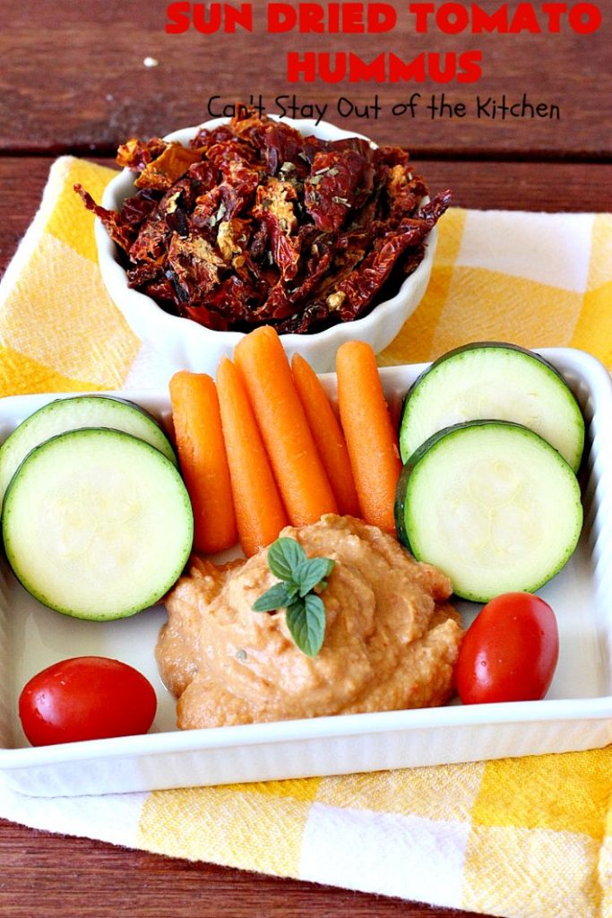 Sun Dried Tomato Hummus | Can't Stay Out of the Kitchen | this #hummus #recipe is fantastic! It includes #SunDriedTomatoes & just a little heat from cayenne pepper. This amazing #appetizer is healthy, low calorie, #GlutenFree & #vegan. Plus it can be whipped up in about 5 minutes! #tailgating #GarbanzoBeans #SunDriedTomatoHummus